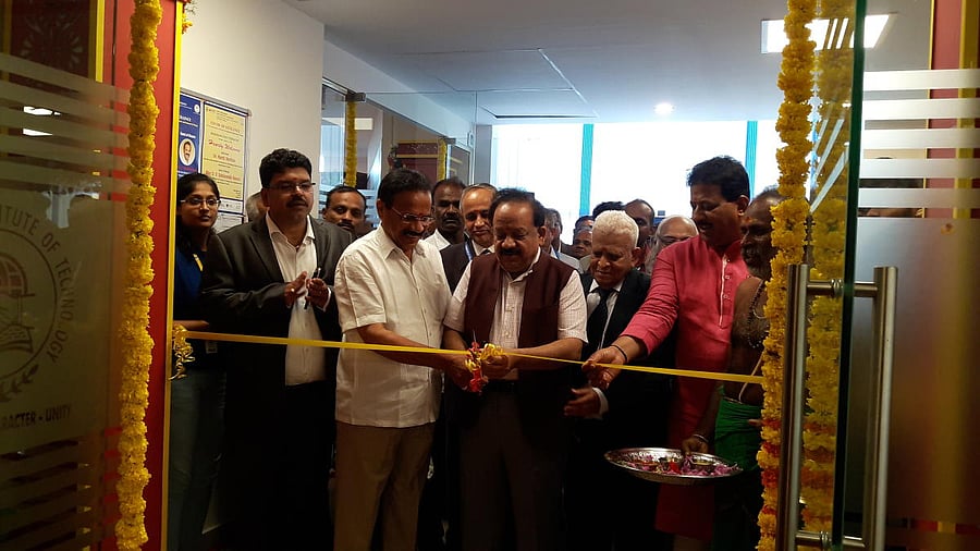 Union Minister for Science and Technology and Earth Sciences Dr Harsh Vardhan (centre) inaugurates the Centre of Excellence in aerospace engineering and internet of things at NMIT along with DV Sadananda Gowda, Union minister for statistics and programme implementation.