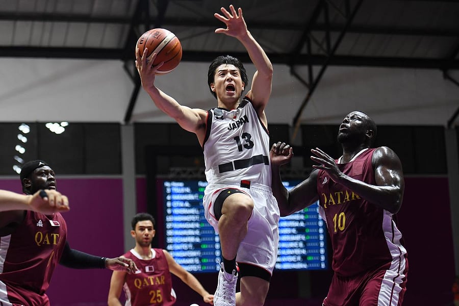 Japan's Takuya Hashimoto (centre) was one of four Japanese basketball that were sent home after paying prostitutes for sex. AFP