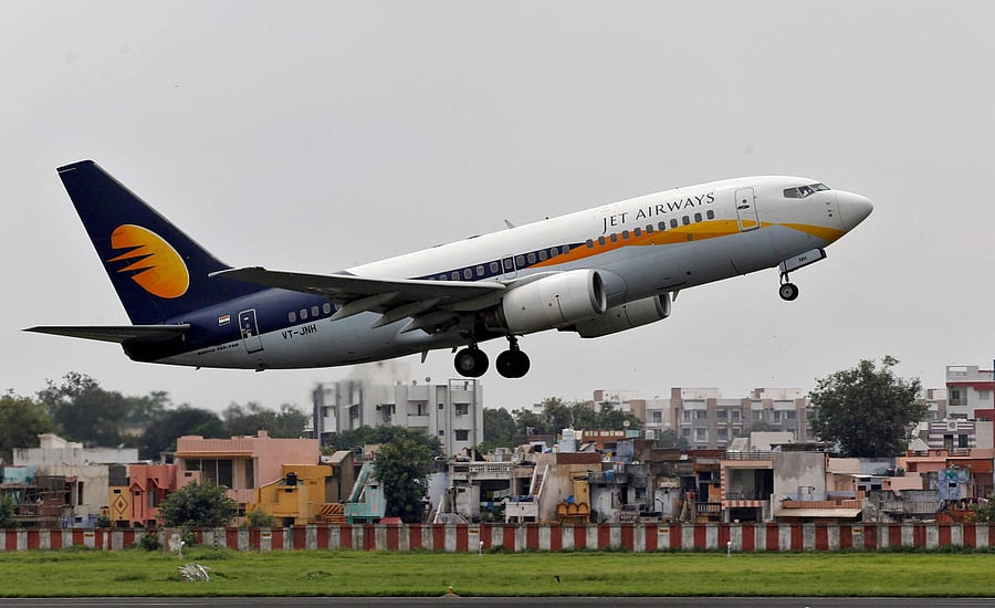FILE PHOTO: A Jet Airways passenger aircraft takes off from the airport in the western Indian city of Ahmedabad. Reuters