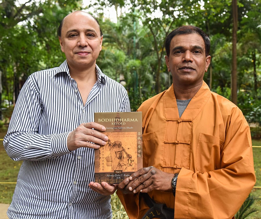 Author Arvind Johar with Acharya Babu T Raghu at a press meet in Bengaluru on Friday. DH Photo/S K Dinesh