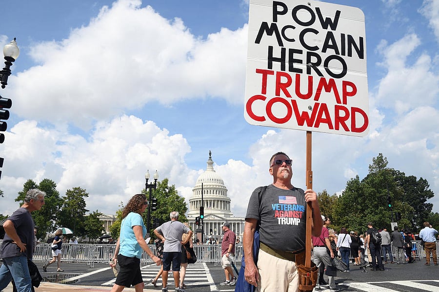 Mourners line up outside the Capitol Visitors Center for the public viewing of the late Senator John McCain's casket in the US Capitol in Washington, US. REUTERS