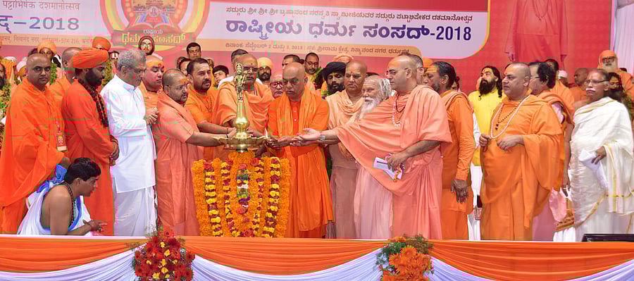 Brahmananda Saraswathi Swami and various seers inaugurate the Rashtriya Dharma Samsad 2018, at Sri Rama Kshetra Mahasamsthanam, Nityananda Nagar, in Dharmasthala on Monday. Dharmasthala Dharmadhikari Dr D Veerendra Heggade looks on.