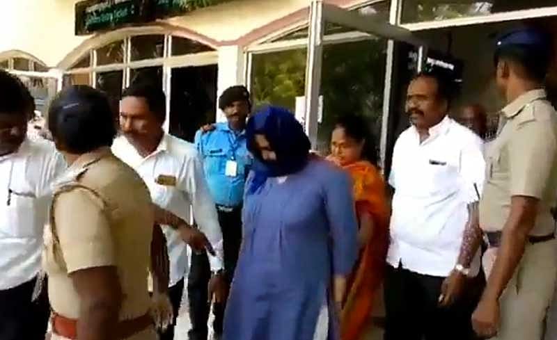 Lois Sophia being escorted out of Tuticorin airport. Screengrab.