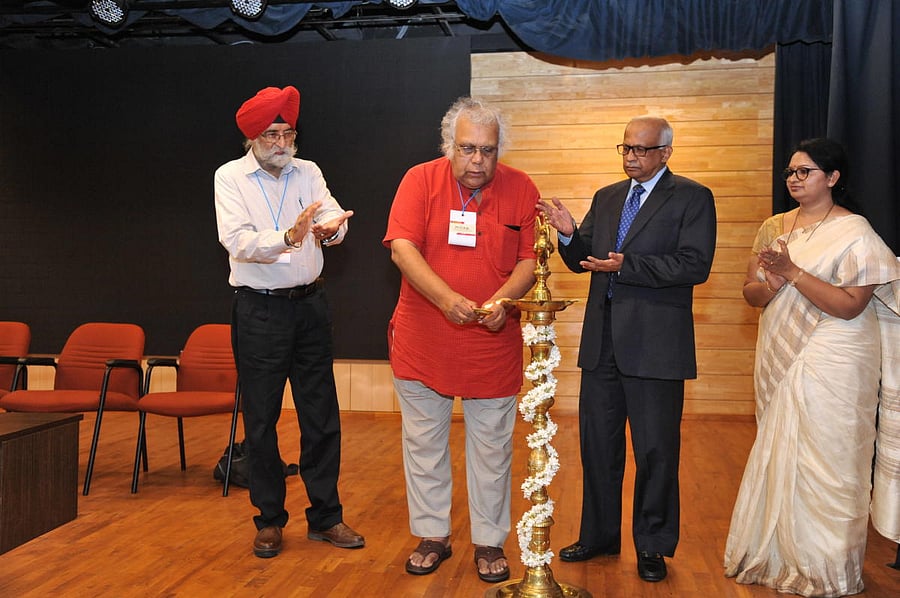 Kannada poet and playwright Prof H S Shivaprakash lighting the lamp at MILAP, at Manipal on Thursday.