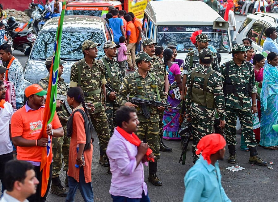 CRPF personnel stand guard during a BJP election campaign ahead of Karnataka Assembly Election 2018 in Bengaluru. PTI Photo