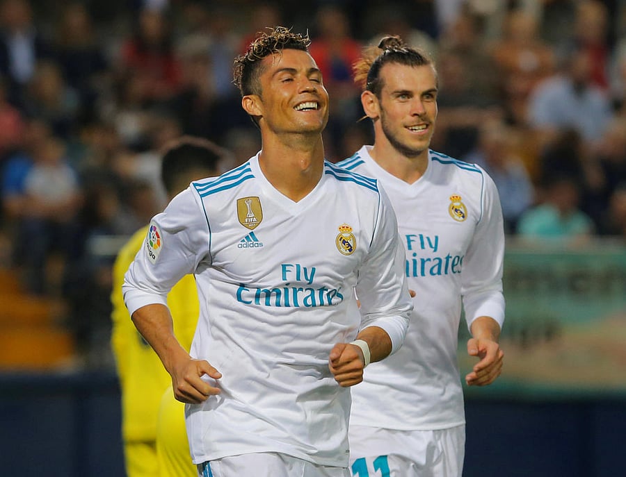 Deadly duo: Real Madrid's Cristiano Ronaldo celebrates with team-mate Gareth Bale after scoring against  Villarreal. REUTERS
