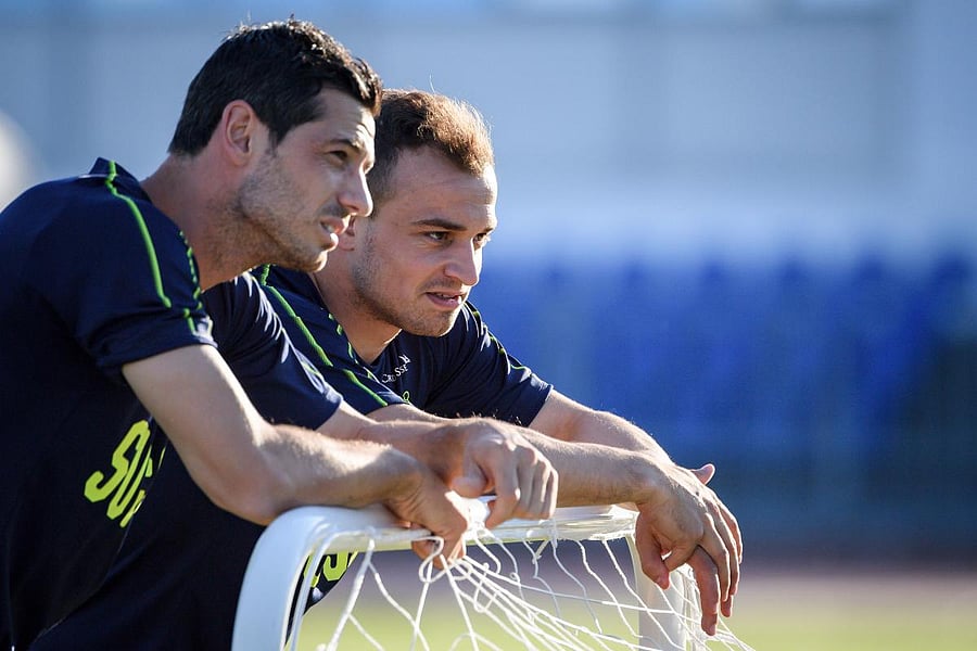 Switzerland's Blerim Dzemaili (left) and Xherdan Shaqiri at a training session. AFP
