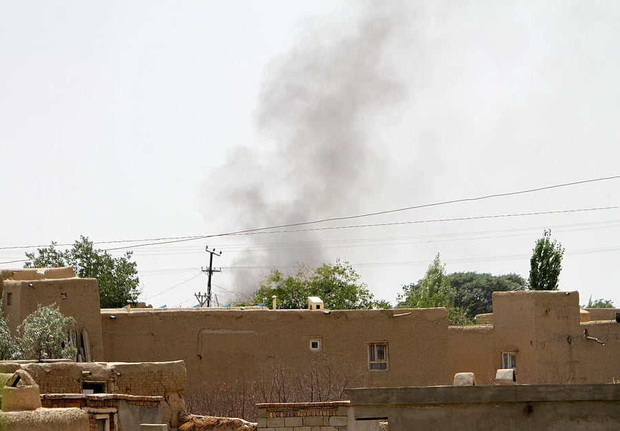 Smoke rises from a residential area where gun battle is going on between Taliban and Afghan forces in Ghazni province, Afghanistan August 10, 2018. REUTERS/Stringer NO RESALES. NO ARCHIVES.
