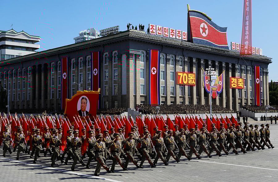 Soldiers march with the portrait of North Korean founder Kim Il Sung during a military parade marking the 70th anniversary of country's foundation in Pyongyang, North Korea, September 9, 2018. REUTERS/Danish Siddiqui