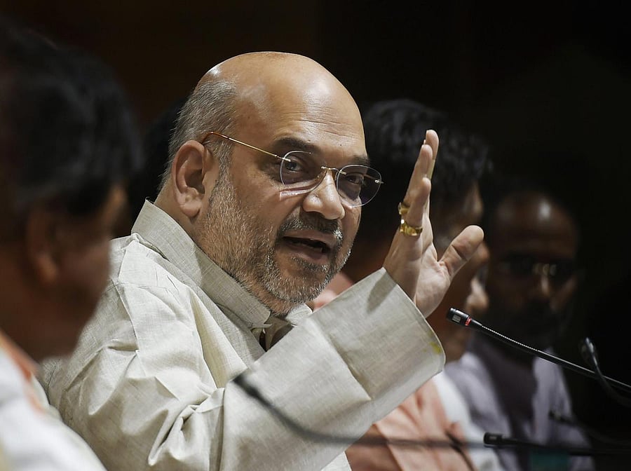 BJP party president Amit Shah addresses a press conference in New Delhi on Monday. PTI
