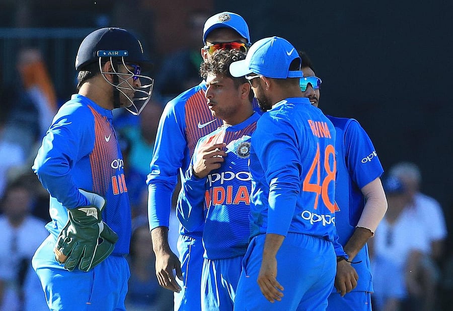 TIMELY JOLT India's Kuldeep Yadav (centre) will be keen to bounce back in the decider after an ordinary show in the second T20I. AFP