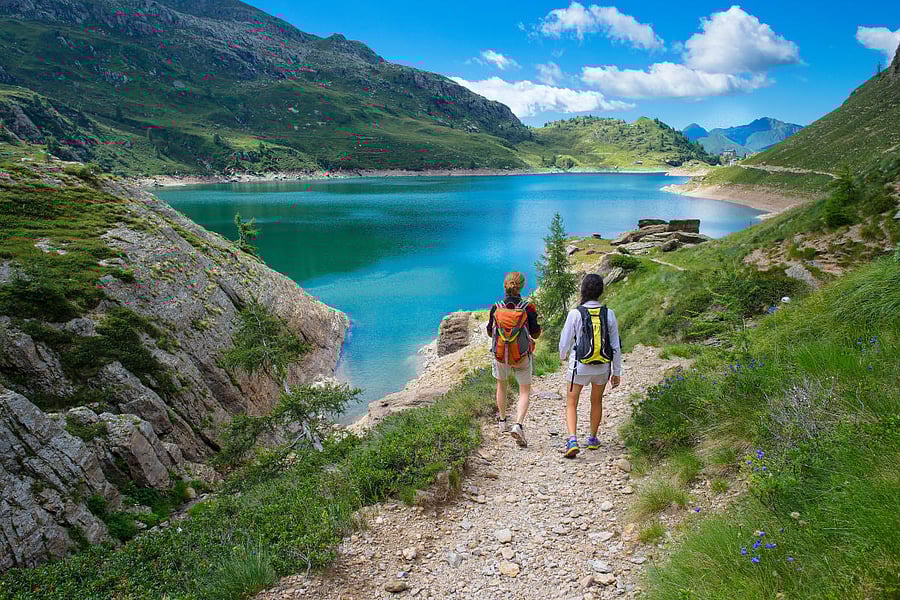Hikers in an alpine lake in Switzerland