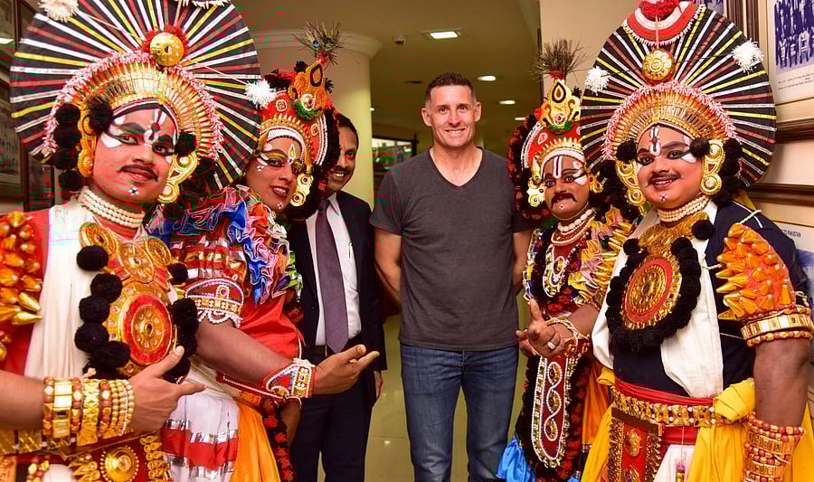 TRADITIONAL TOUCH: Former Australian batsman Mike Hussey (centre) with Yakshagana artistes at a KPL event in Bengaluru on Wednesday. DH PHOTO/BH Shivakumar 