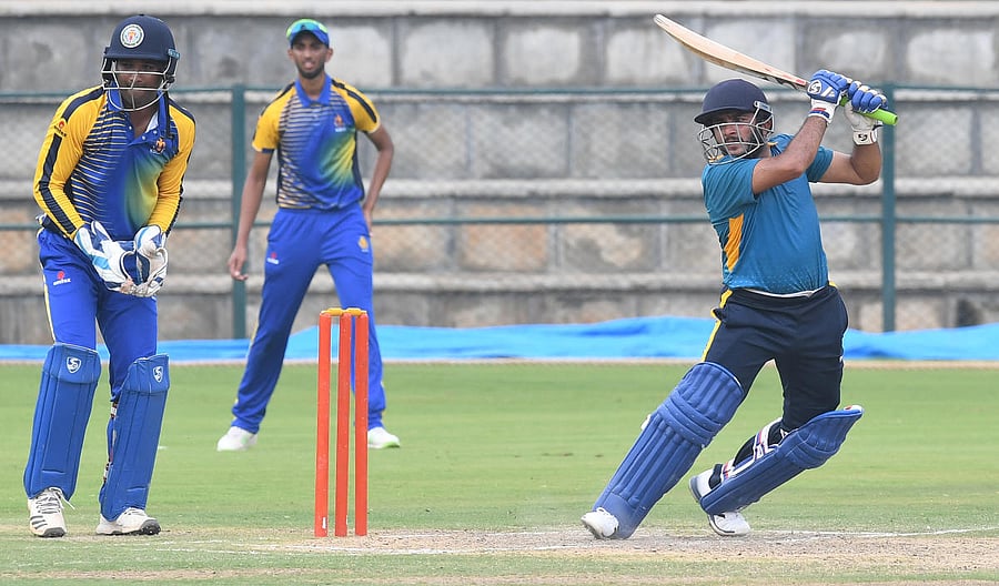 Brilliant: Kedar Devdhar of Baroda slams one to the fence en route his 123 on Wednesday. DH PHOTO/SRIKANTA SHarma r