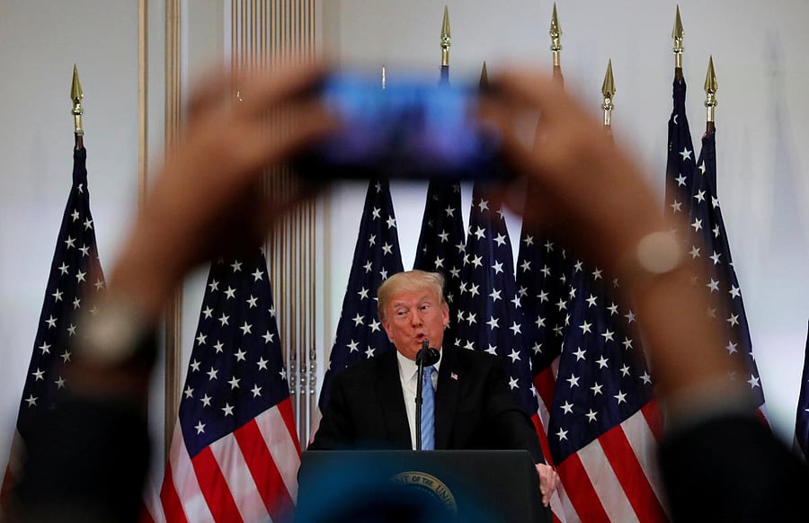 A reporter uses his mobile phone to record U.S. President Donald Trump at a news conference on the sidelines of the 73rd session of the United Nations General Assembly in New York, U.S., September 26, 2018. Reuters