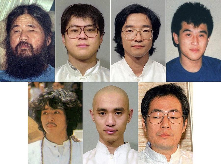 This combination of file photos shows Aum Shinrikyo cult leader Shoko Asahara, from top left to right, his cult members, Tomomasa Nakagawa, Seiichi Endo, and Masami Tsuchiya. Other members from bottom left to right, Yoshihiro Inoue, Tomomitsu Nimi, and Ki