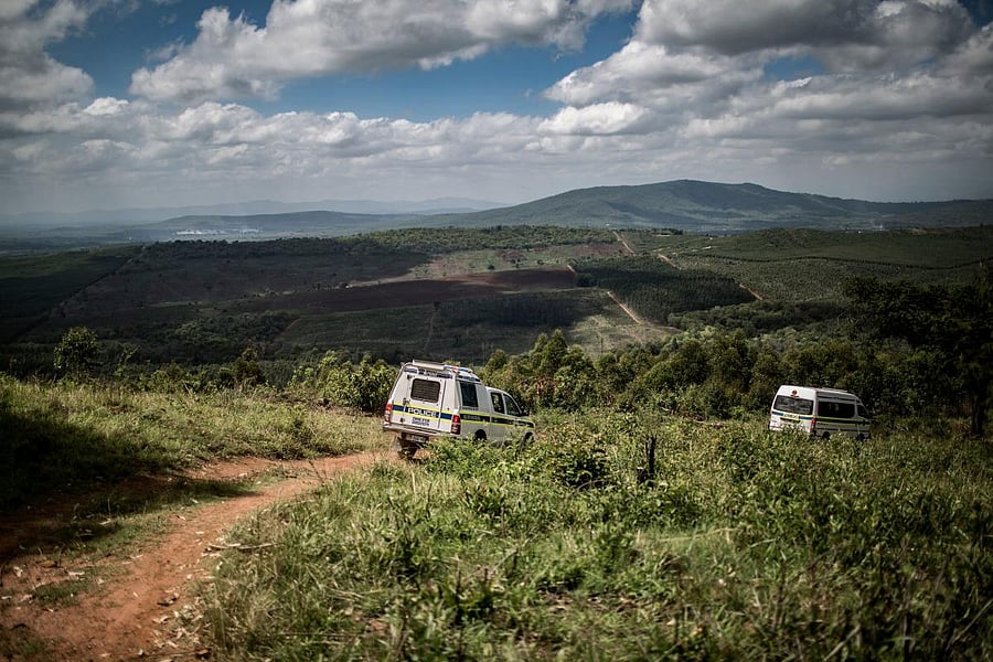 In this file photo taken on November 2, 2017 South African police respond to an incident in which a farm worker was held at gunpoint and a chainsaw was stolen in Tzaneen, South Africa. AFP