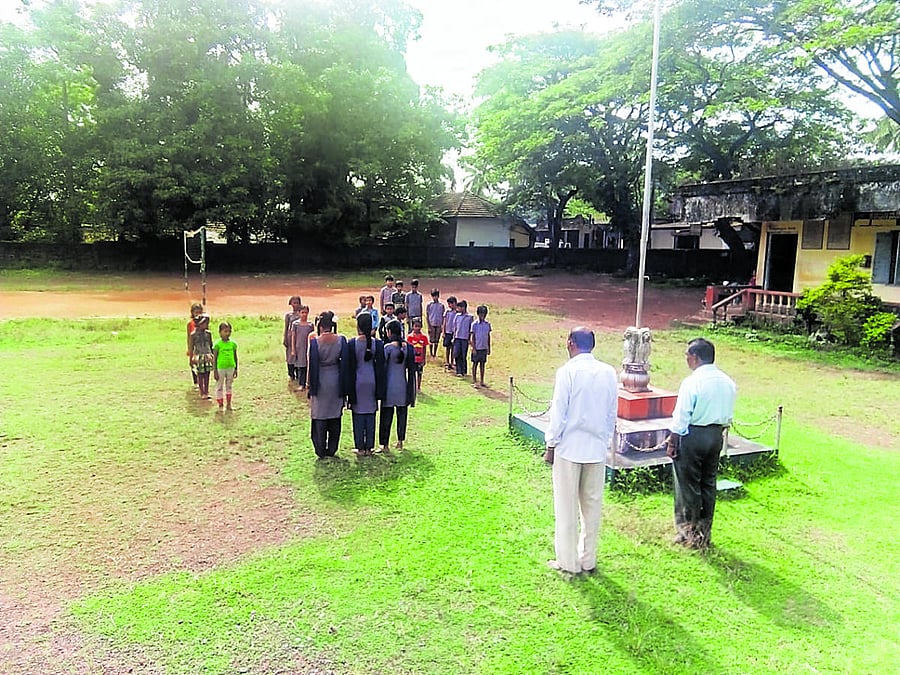 The schoolchildren take part in the morning assembly.