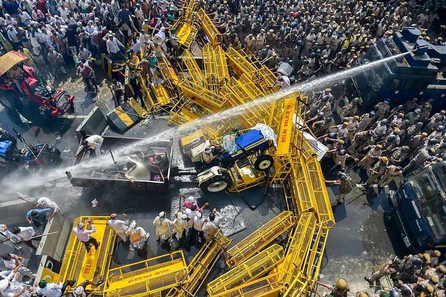 Police use water cannons to disperse farmers protesting at Delhi-UP border during 'Kisan Kranti Padyatra' in New Delhi. PTI Photo 