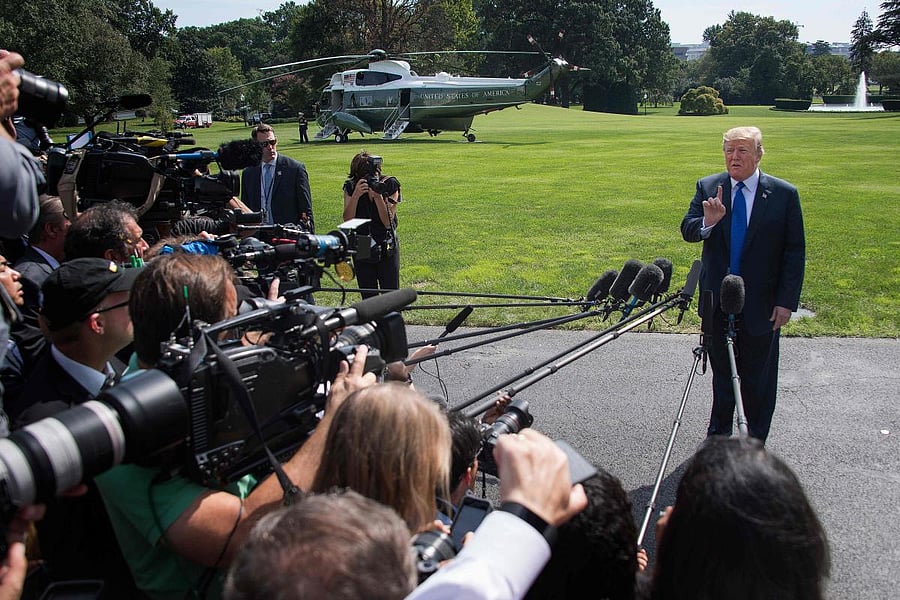 US President Donald Trump speaks as he departs the White House in Washington, DC, on October 2, 2018. (AFP Photo)