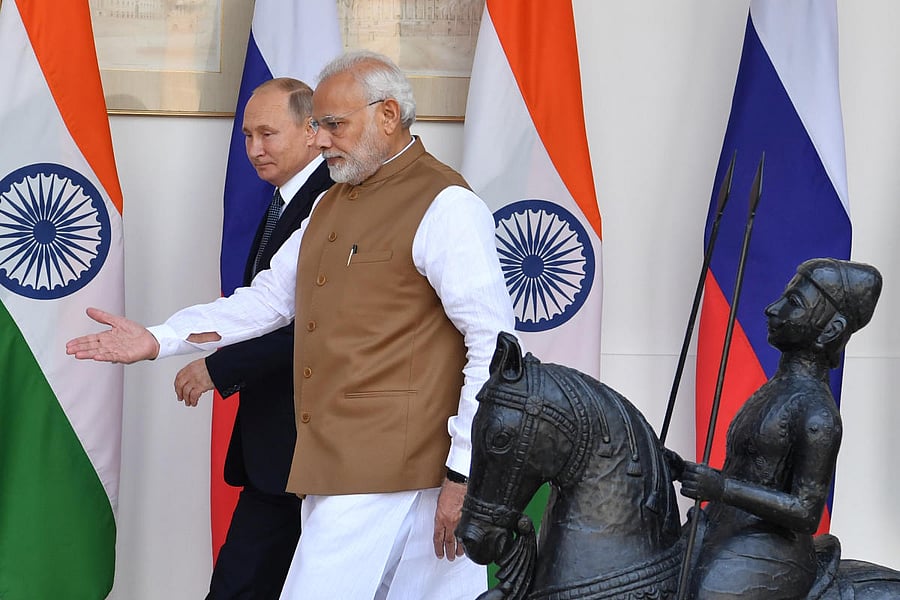 Indian Prime Minister Narendra Modi shows the way to Russian President Vladimir Putin prior to their meeting at Hyderabad House in New Delhi, India, October 5, 2018. (REUTERS)