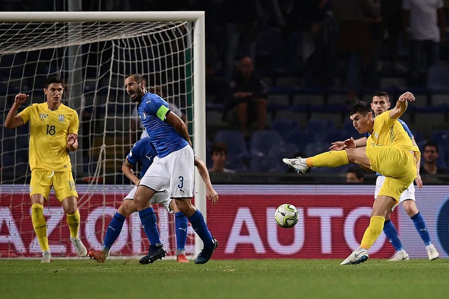 Ukraine's Ruslan Malinovskyi (right) shoots to score an equaliser during a friendly against Italy on Wednesday. AFP