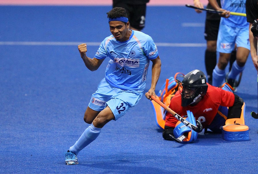 India's Shilanand Lakra celebrates after scoring against Great Britain during their round-robin clash on Friday.