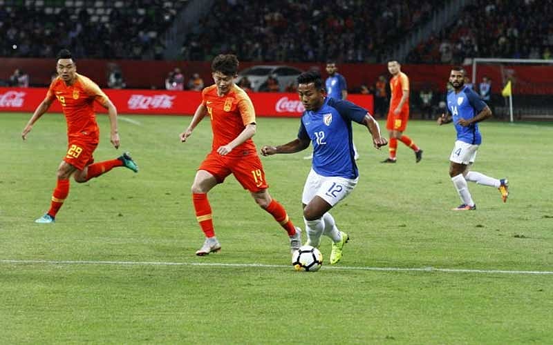 India's Jeje Lalpekhlua (right) attempts to get past China's Wang Tong during their friendly in Suzhou on Saturday.