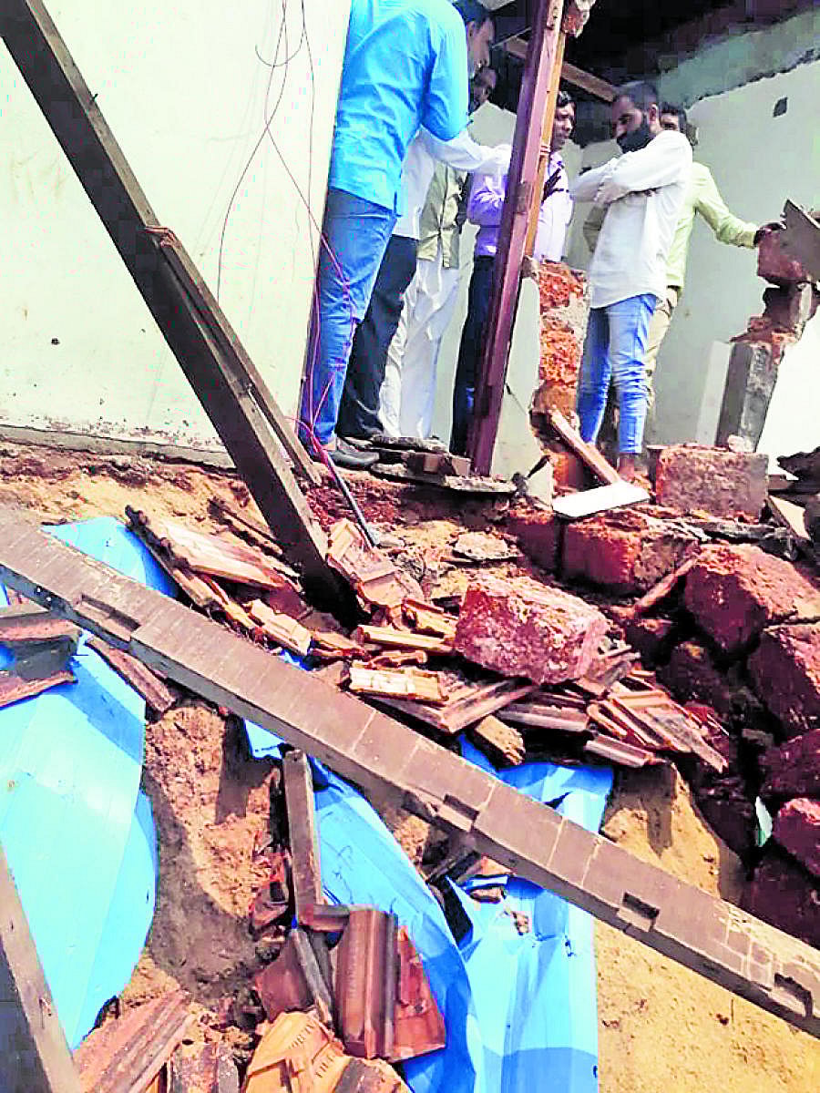 A house damaged following sea erosion at Ullal.
