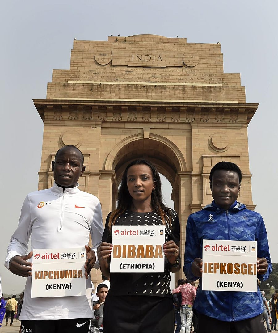 Half-marathon world record holder Joyciline Jepkosgei (right) and Olympic gold medallist Tirunesh Dibaba ahead of the Delhi Half-Marathon. PTI