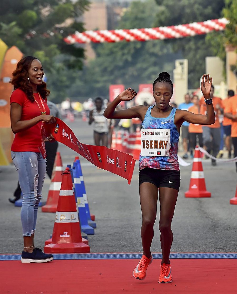 TRIUMPHANT: Ethiopia's Tsehay Gemechu crosses the finish line to win the Delhi Half Marathon title. PTI