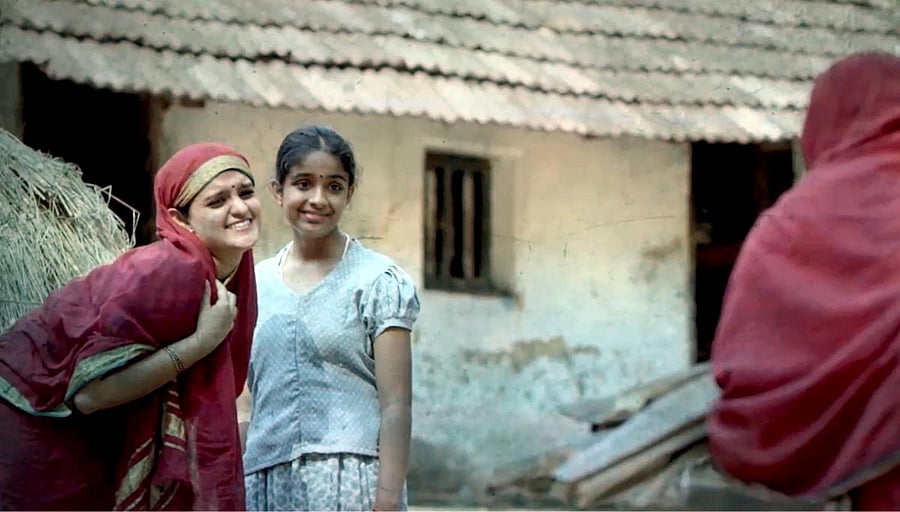 Vyjayanthi V Adiga and Diya Palakkal in a scene of Kannada movie 'Ammacchiyemba Nenapu'.