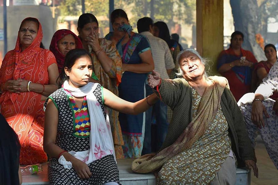 Relatives mourn the death during a mass funeral of victims of rail accident in Amritsar on Saturday. Officials said at least 60 bodies have been found and many more injured have been admitted to a government hospital after the accident near the site of Dussehra festivities. PTI Photo