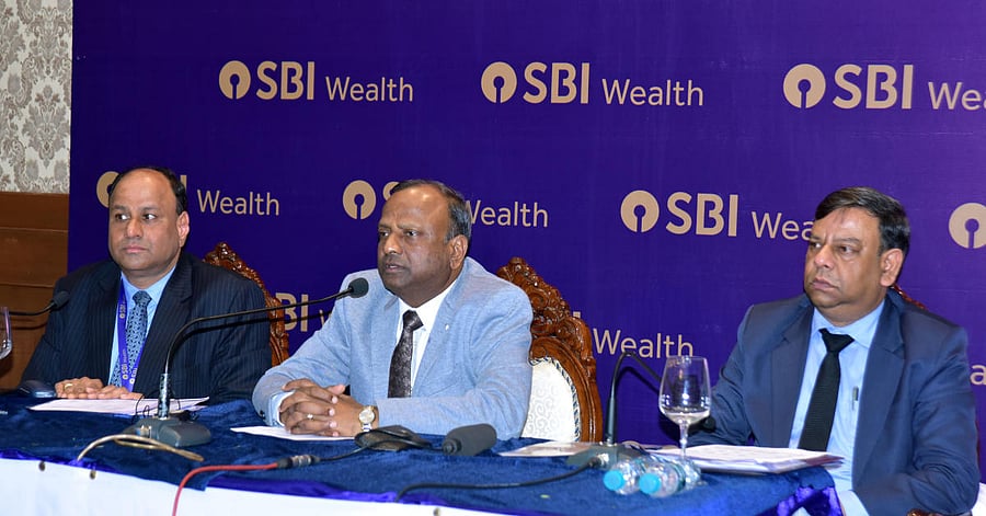 SBI Chairman Rajnish Kumar addresses a press meet in Mangaluru on Saturday.