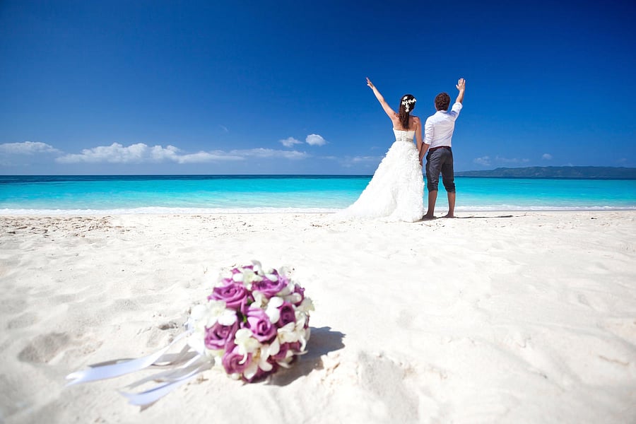 A newly wed couple on the beach