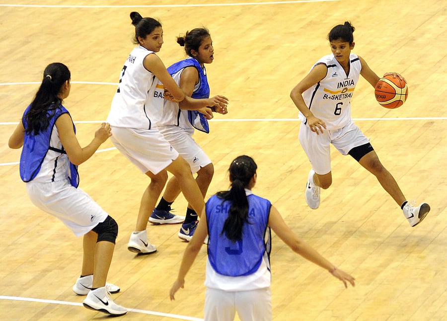GEARING UP Indian basketball players during a training session at the Koramangala Indoor Stadium on Saturday. DH PHOTO/ Srikanta Sharma R