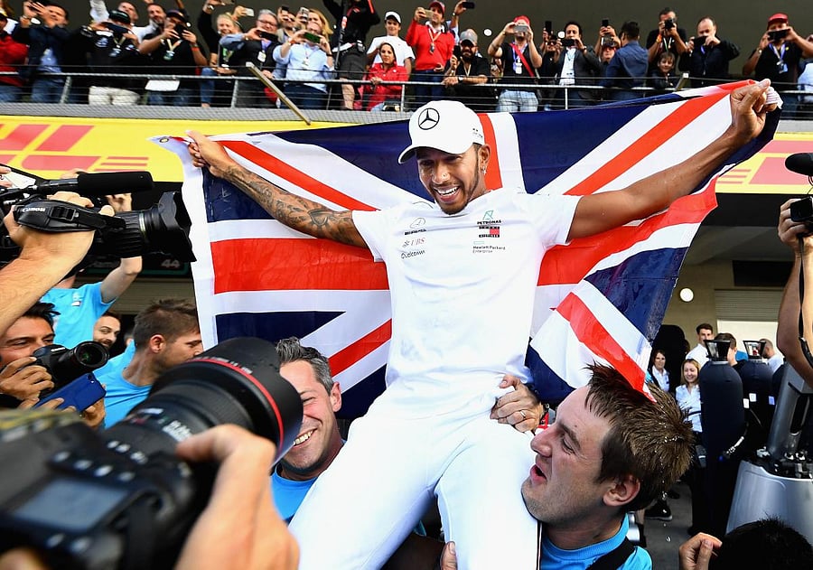 2018 F1 World Drivers Champion Lewis Hamilton of Great Britain and Mercedes GP celebrates with his team after the Formula One Grand Prix of Mexico at Autodromo Hermanos Rodriguez on October 28, 2018 in Mexico City, Mexico. (Clive Mason/Getty Images/AFP)