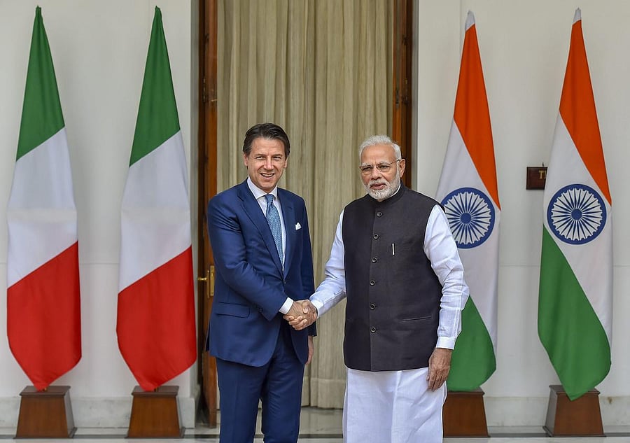 Prime Minister Narendra Modi shakes hands with Italian Prime Minister Giuseppe Conte before a meeting at Hyderabad House, in New Delhi on Tuesday. PTI