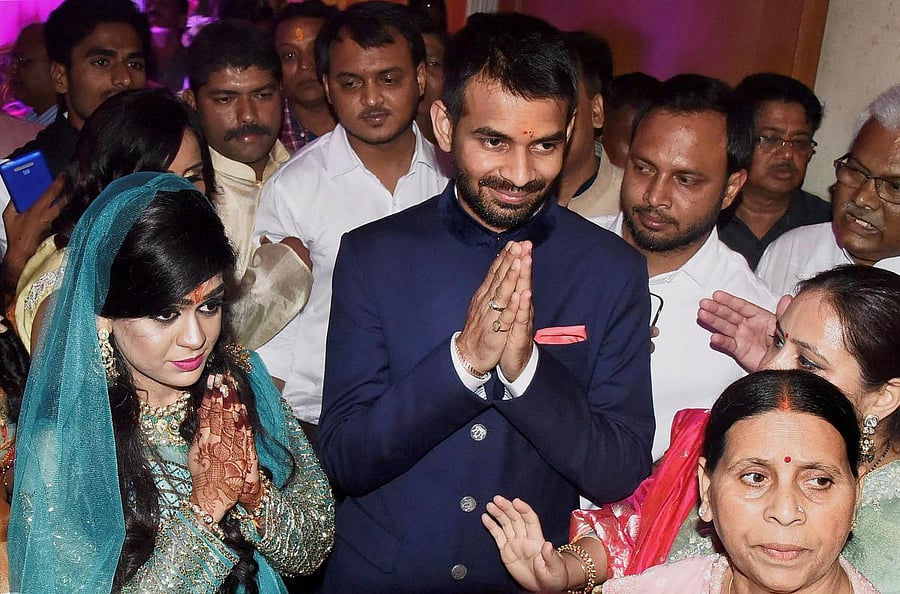A file photo: Tej Pratap Yadav with fiancee Aishwarya Rai granddaughter of former Bihar chief minister Daroga Prasad Rai during their engagement function in Patna. (PTI file photo)