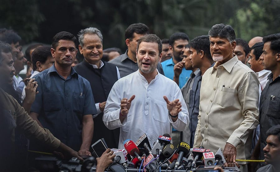 Congress President Rahul Gandhi along with Andhra Pradesh Chief Minister N Chandrababu Naidu addresses the media outside his residence at Tughlak Road in New Delhi on Thursday. PTI