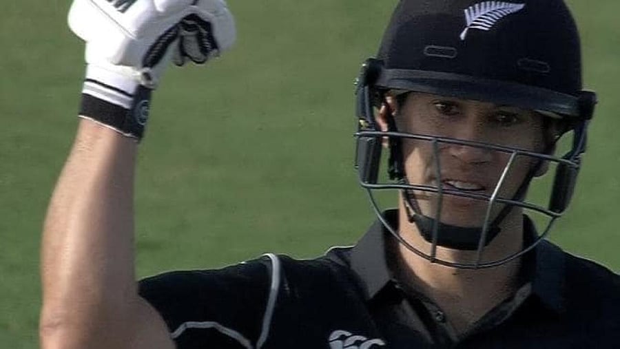 Ross Taylor gestures with a bent arm questioning Hafeez’s action
