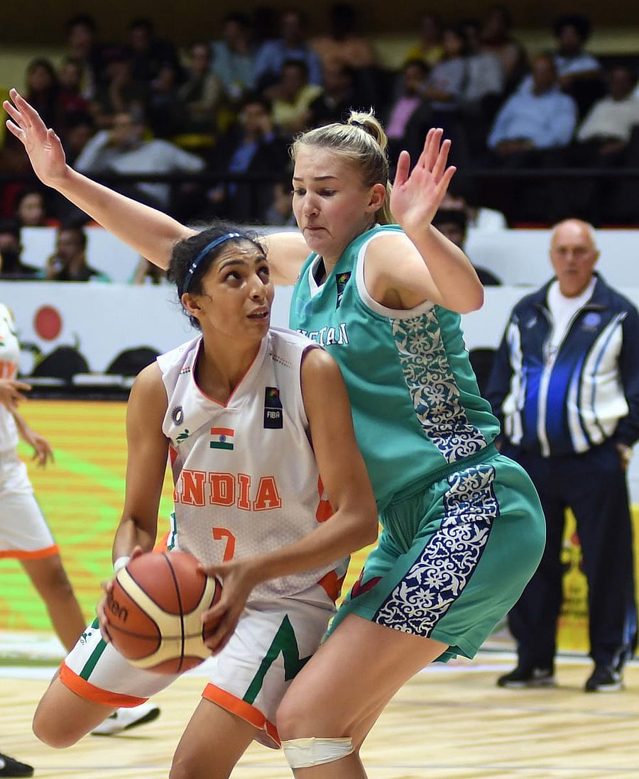 Swift rise Harshitha Bopaiah (left) in action in the Division B final of the FIBA U-18 Women’s Asian Basketball championship. DH Photo/ Srikanta Sharma R