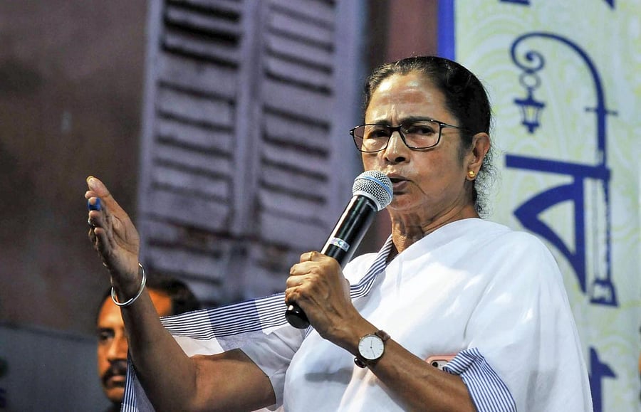 West Bengal Chief Minister Mamata Banerjee addresses the gathering during the inauguration of Goddess Kali Puja, ahead Kali Puja festival, in Kolkata on Friday. PTI