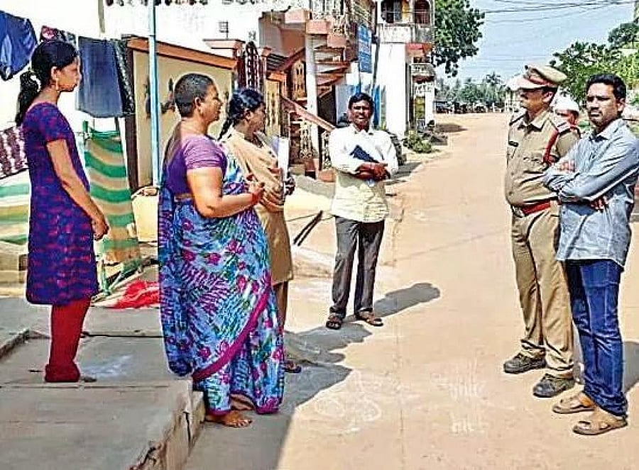 Tahasildar MS Raju and Sub Inspector Vijay Kumar meeting with women of village on Friday
