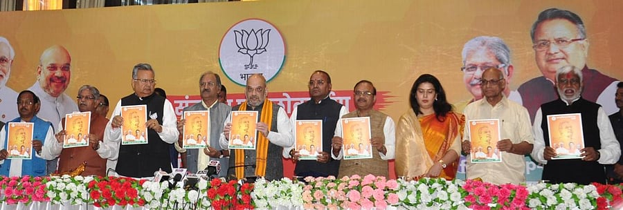 BJP president Amit Shah, Chhattisgarh Chief Minister Dr Raman Singh along with other leaders release their party's election manifesto for the poll-bound state.