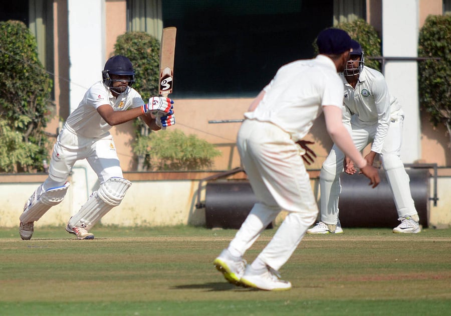Karnataka opener D Nischal drives one to the fence during his unbeaten 66 on the second day of their Ranji Trophy match against Vidarbha in Nagpur on Tuesday. DH Photo 