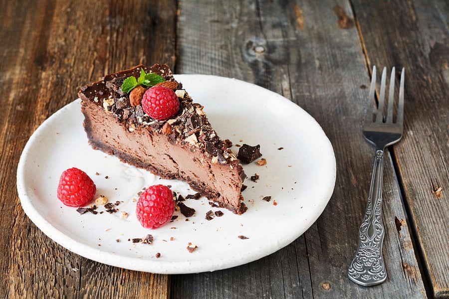 Chocolate cheescake or chocolate pie slice on white plate1