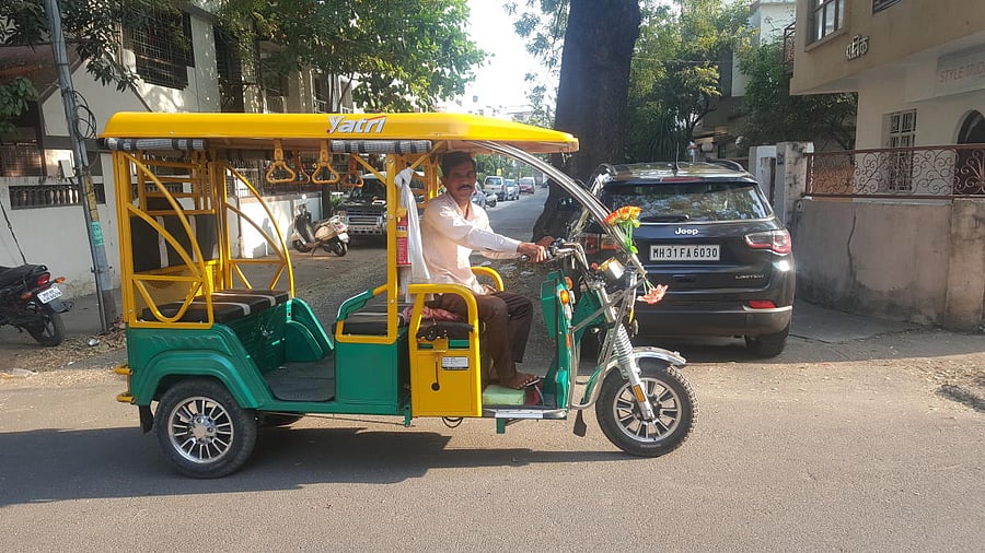 e-auto driver, Raju Vittal Pragat in his auto