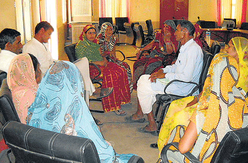 Panchayat members in discussion at Etava in Rajasthan.