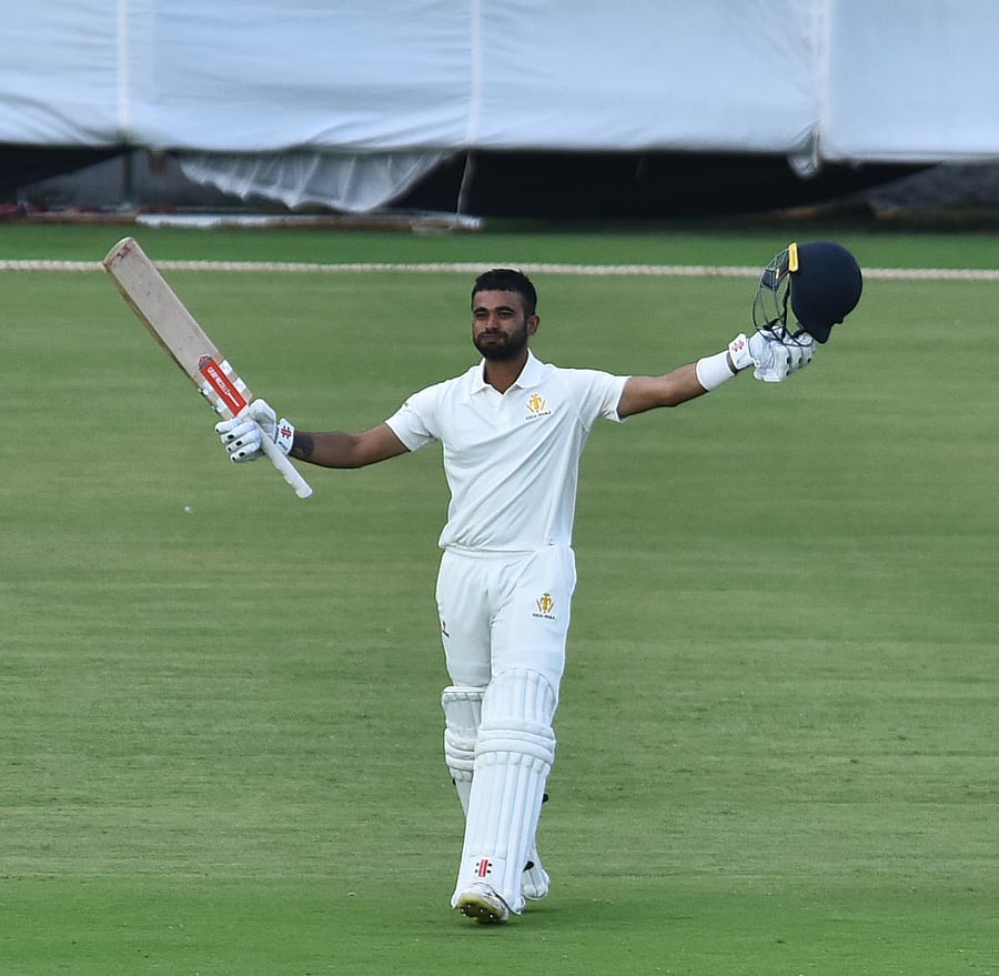 Karnataka's K V Siddharth celebrates after reaching his maiden first-class ton against Mumbai in Belagavi on Tuesday. DH PHOTO/TAIJUDDIN AZAD